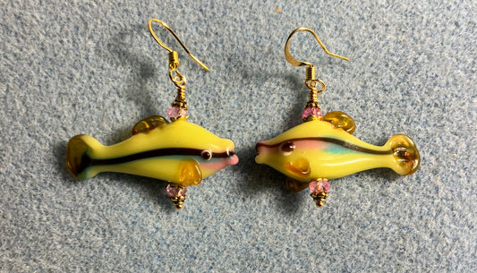 Yellow, pink, and green lamp work bead earrings adorned with pink Chinese crystal beads.