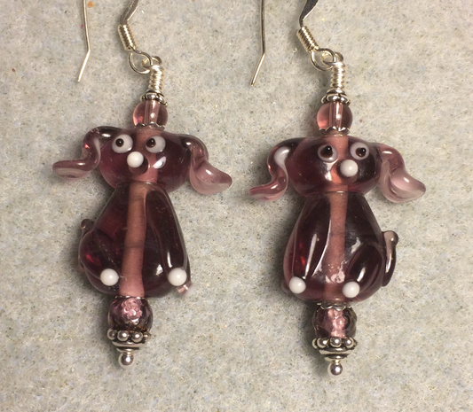Translucent violet lamp work floppy eared puppy dog bead earrings adorned with violet Czech glass beads.