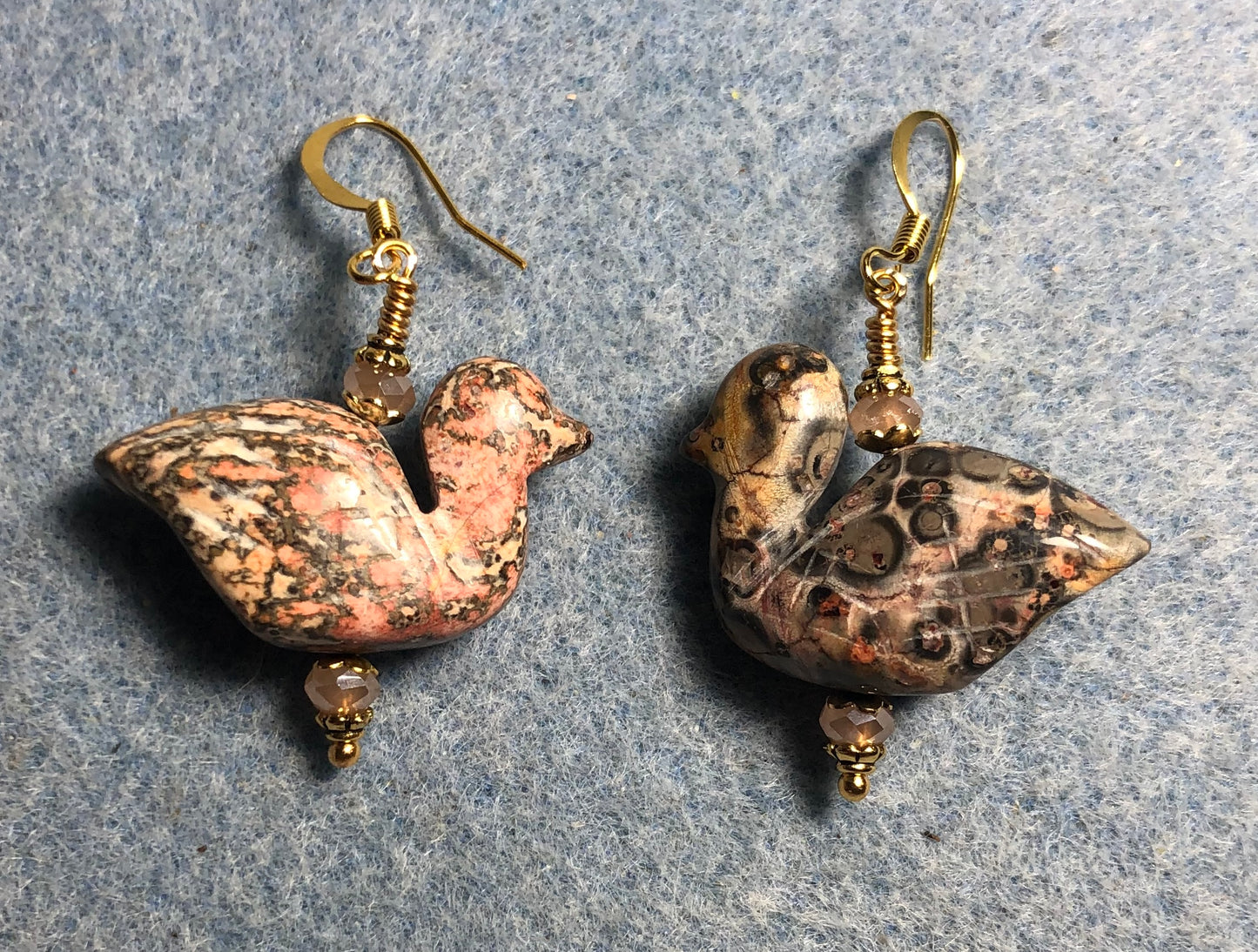 Pink leopard skin jasper gemstone duck bead earrings adorned with peach Chinese crystal beads.