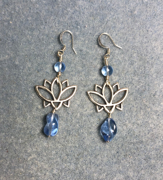 Silver lotus flower connector charm earrings adorned with vintage light blue Czech glass twist beads and light blue Czech glass beads.