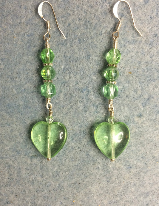 Light green Czech glass heart bead earrings adorned with light green Czech glass beads.