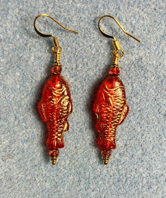 Bright red (with gold inlay) Czech glass fish bead earrings adorned with red Chinese crystal beads.