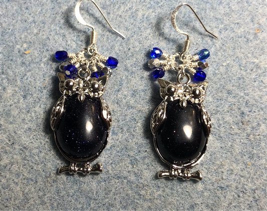 Large silver and blue goldstone gemstone owl charm earrings adorned with small dangling dark blue and silver Czech glass beads.