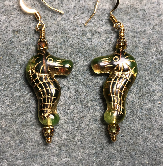 Greenish brown (with gold inlay) Czech glass seahorse bead earrings adorned with sparkly olive green Chinese crystal beads.