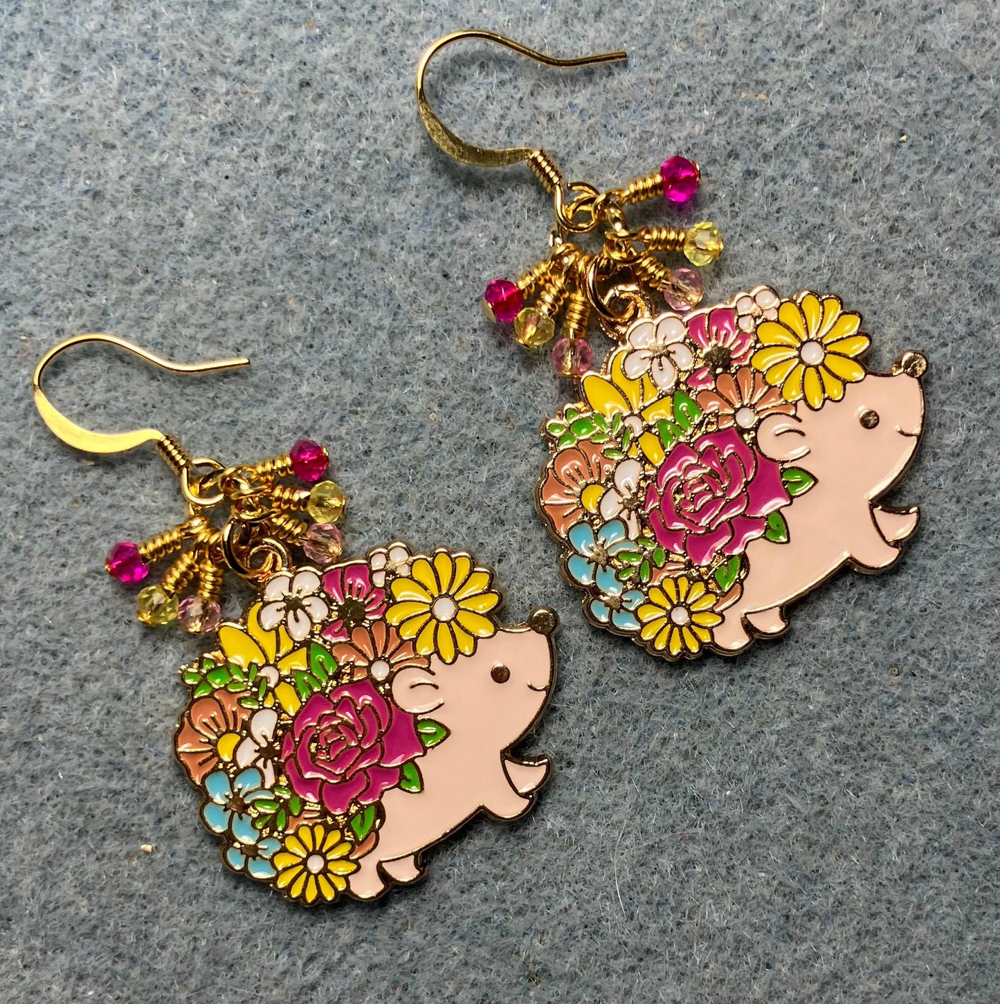 Light pink, yellow, and hot pink enamel porcupine charm earrings adorned with tiny dangling light pink, yellow, and hot pink Chinese crystal beads.