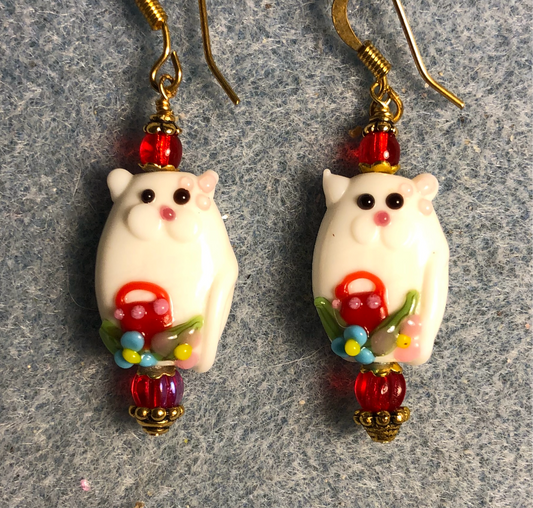 White and red lamp work cat bead earrings adorned with red Czech glass beads.