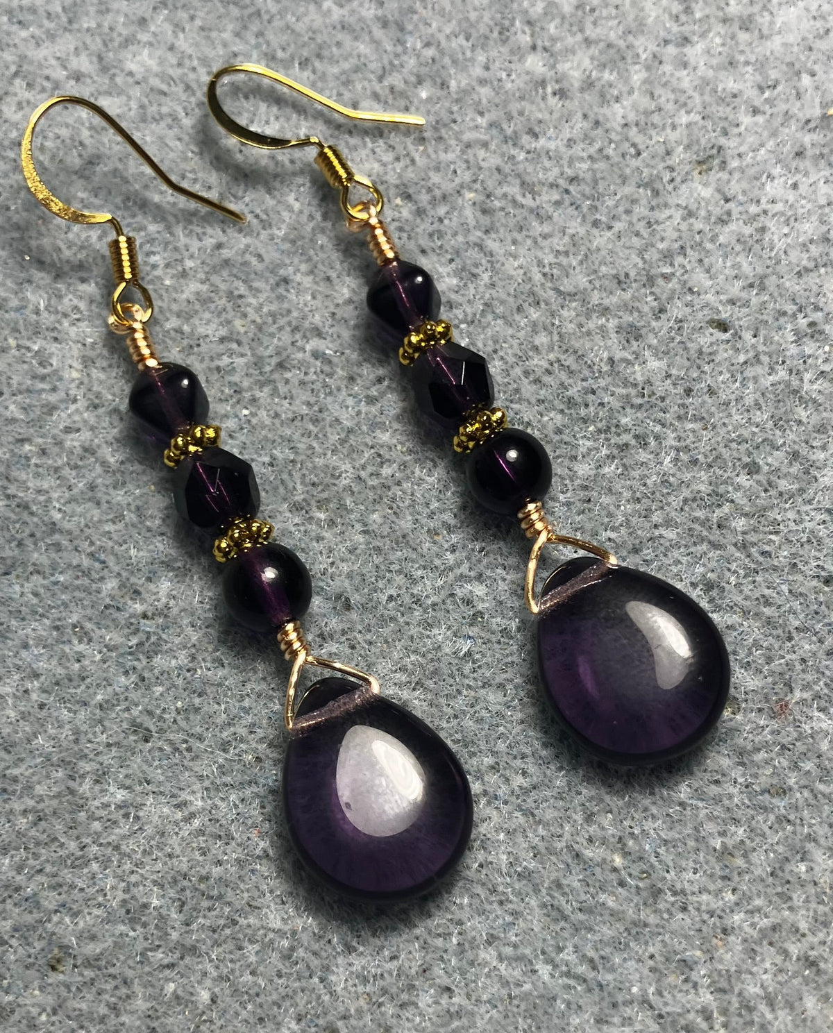 Grape purple Czech glass pear drop bead earrings adorned with  grape purple Czech glass beads.