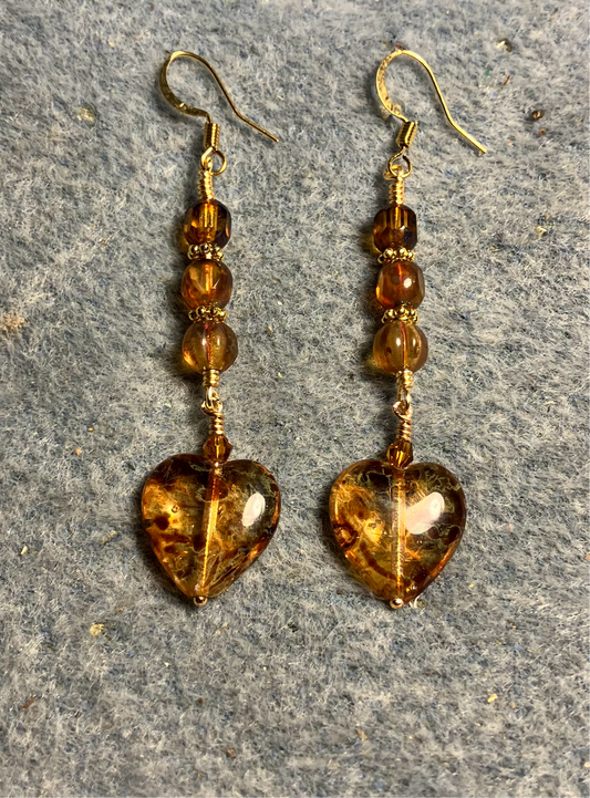 Amber speckled Czech glass heart bead earrings adorned with amber Czech glass beads.