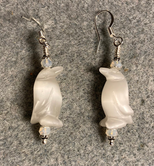 White fiber optic (cat’s eye) penguin bead earrings adorned with white Chinese crystal beads.