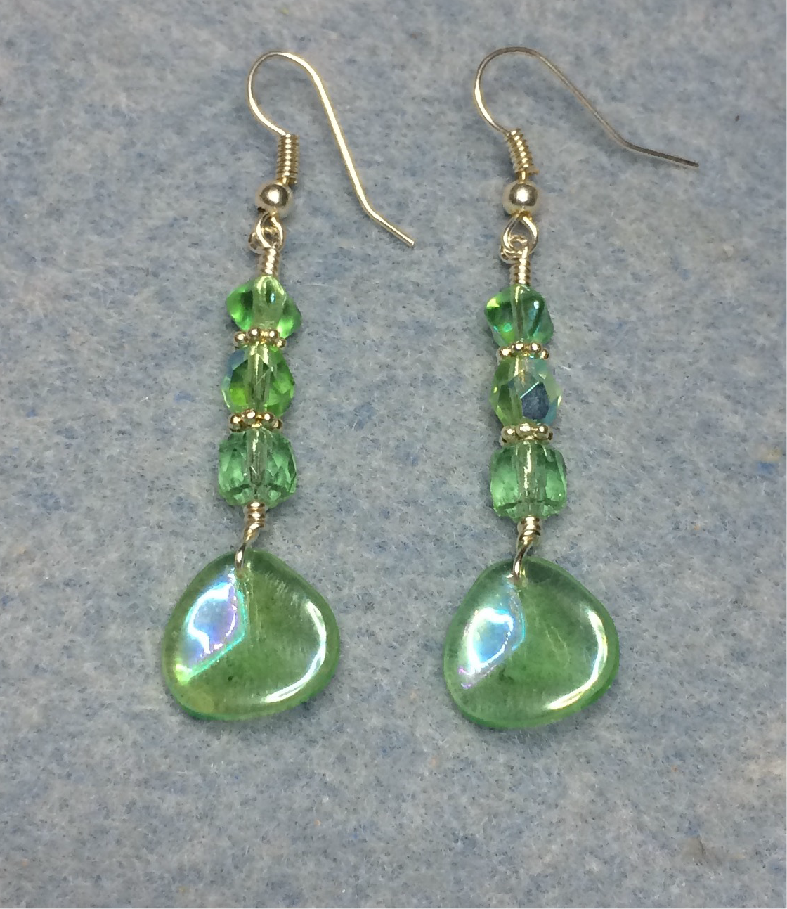 Light green Czech glass rose petal earrings adorned with light green Czech glass beads.