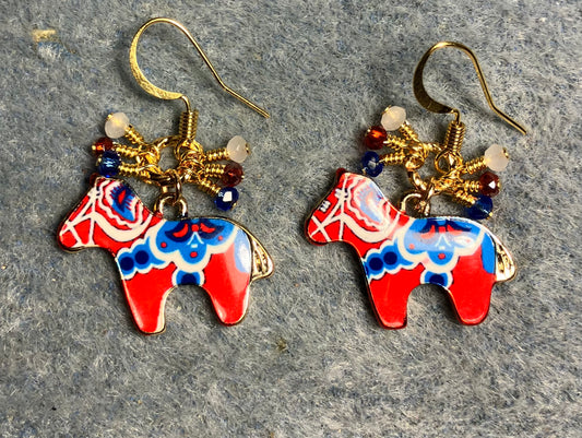 Red, blue, and white enamel horse charm earrings adorned with tiny dangling red, blue, and white Chinese crystal beads.