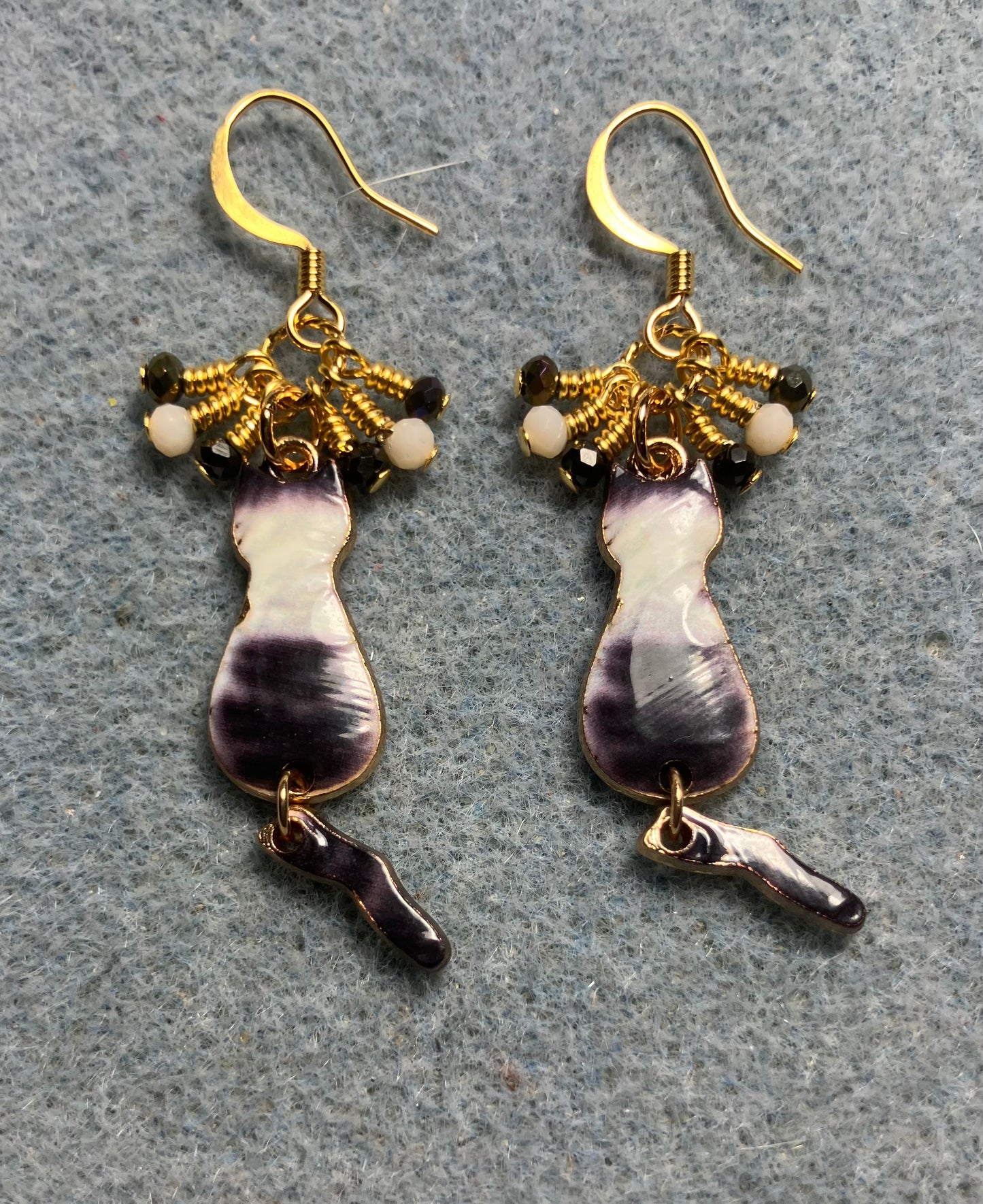 Gray and white enamel cat charm earrings adorned with tiny dangling gray and white Chinese crystal beads.