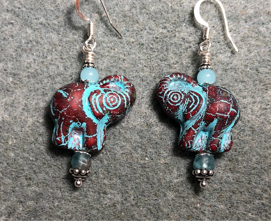 Dark red (with turquoise inlay) Czech glass elephant bead earrings adorned with turquoise Czech glass beads.