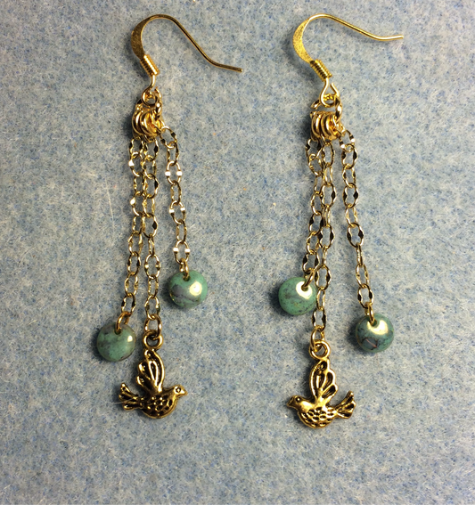 Small gold dove charm earrings attached to gold chain and adorned with small teal Czech glass lentil beads