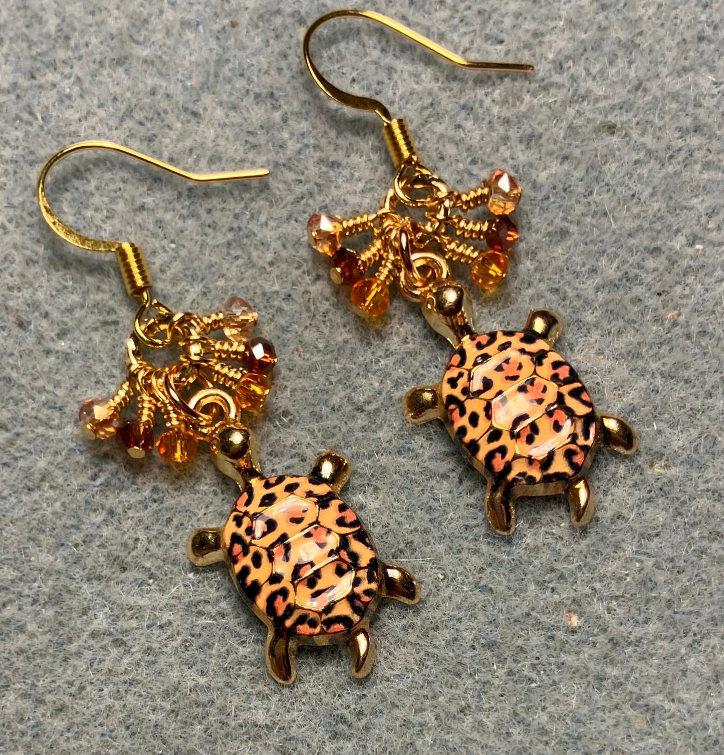 Orange, brown, and amber enamel turtle charm earrings adorned with tiny dangling orange, brown, and amber Chinese crystal beads.