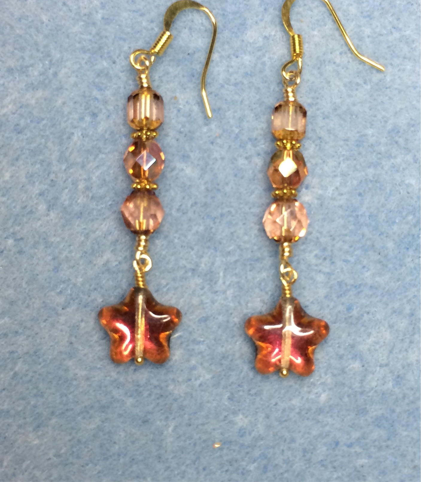 Small sparkly peach Czech glass star bead earrings adorned with peach Czech glass beads.