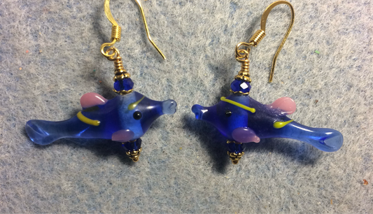 Translucent dark blue, pink, and yellow lamp work fish bead earrings adorned with dark blue Chinese crystal beads.