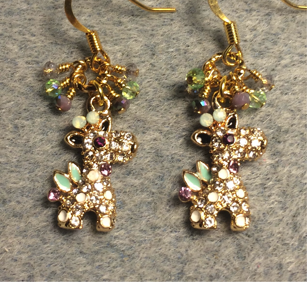 Light green and purple rhinestone giraffe charm earrings adorned with tiny dangling purple, green, and clear Chinese crystal beads.