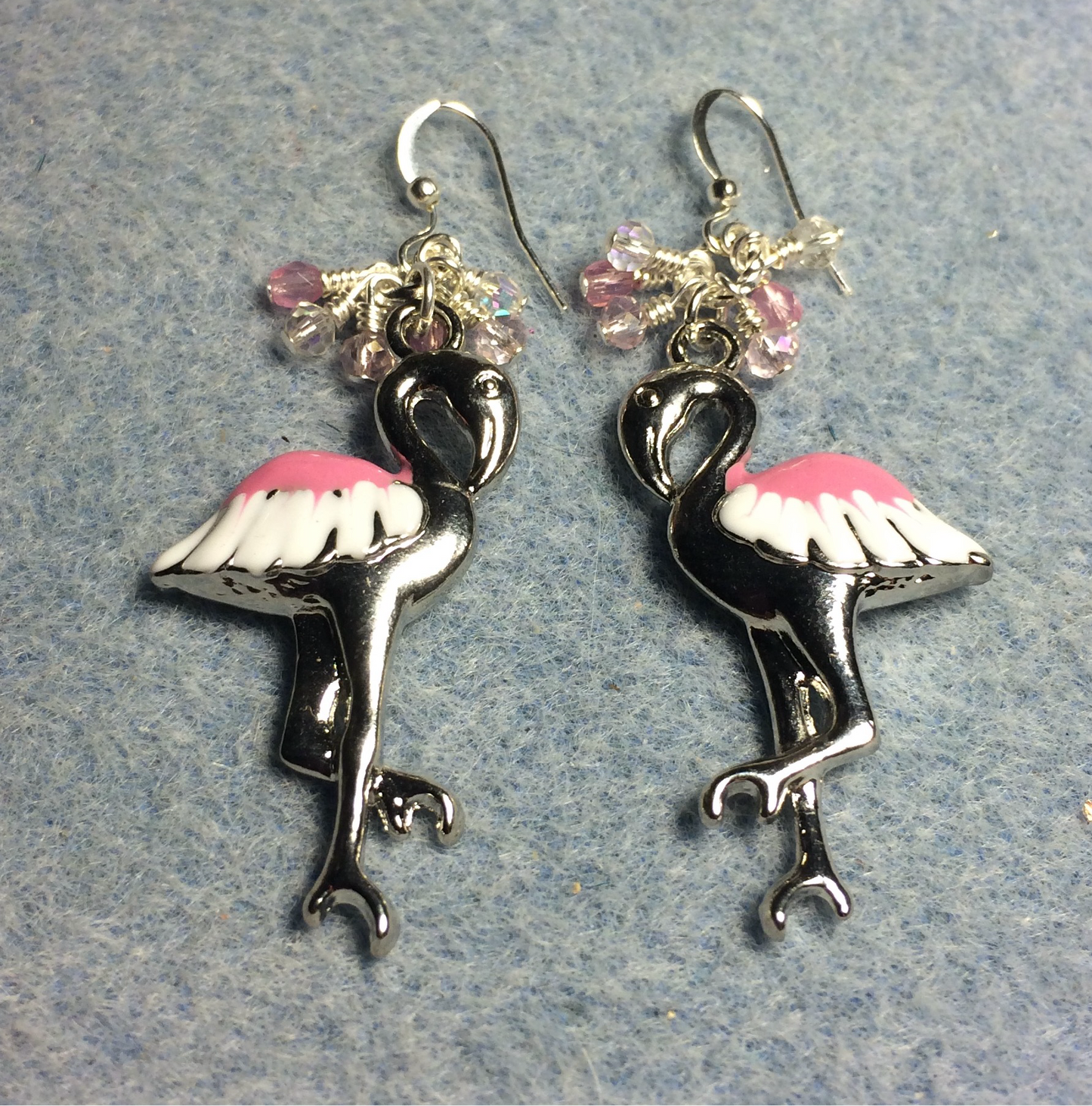 Large silver, white, and pink enamel flamingo charm earrings adorned with tiny dangling pink and clear Chinese crystal beads.