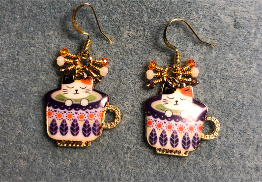 Purple, white, and orange enamel cat sitting in a cup charm earrings adorned with tiny dangling purple, white, and orange Chinese crystal beads.