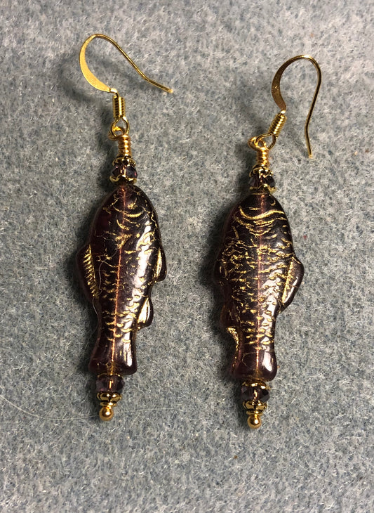Purple (with gold inlay) Czech glass fish bead earrings adorned with purple Chinese crystal beads.