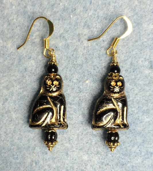 Black (with gold inlay) Czech glass cat bead earrings adorned with black Czech glass beads.
