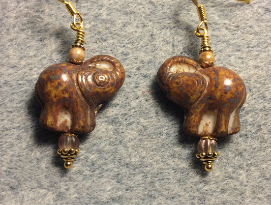 Brown (with cream inlay) Czech glass elephant bead earrings adorned with brown Czech glass beads.