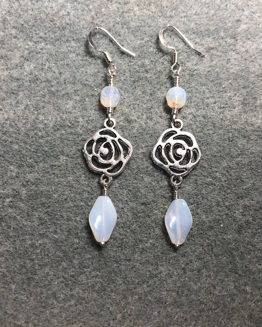 Silver rose connector charm earrings adorned with white Czech glass twist beads and white Czech glass beads.