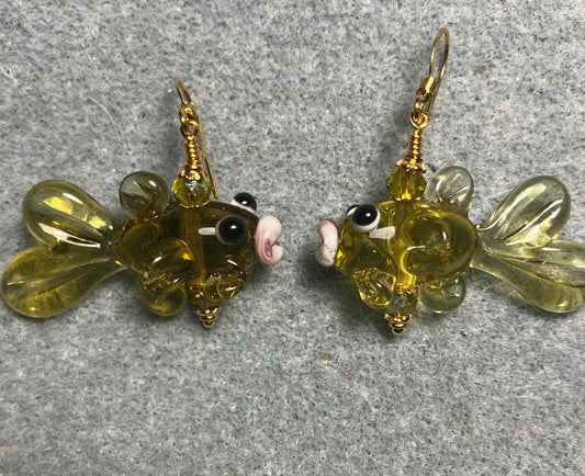 Translucent olive green lamp work fish bead earrings adorned with olive green Chinese crystal beads.
