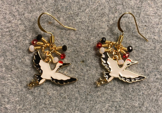 Black, white, and red enamel flying crane charm earrings adorned with tiny black, white, and red Chinese crystal beads.