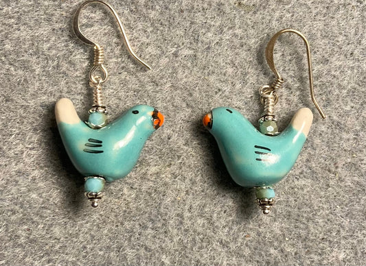 Small turquoise and white ceramic bird bead earrings adorned with turquoise Chinese crystal beads.