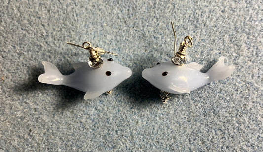 Light blue lamp work whale bead earrings adorned with light blue Chinese crystal beads.