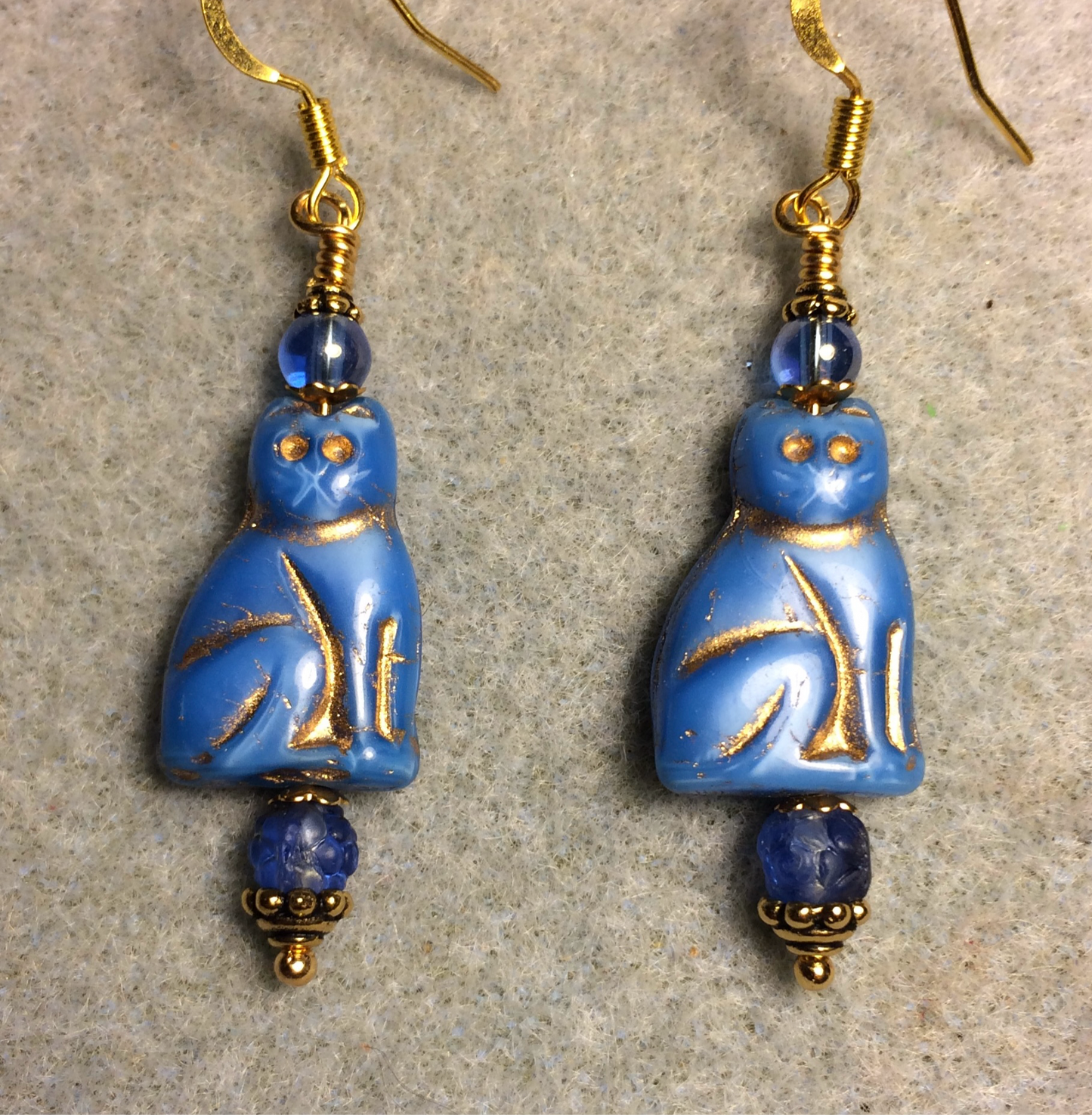 Blue (with gold inlay) Czech glass cat bead earrings adorned with blue Czech glass beads.