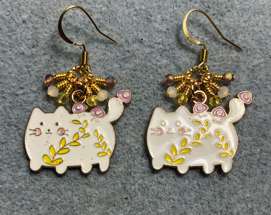 White, yellow, and violet enamel cowboy cat charm earrings adorned with tiny dangling white, yellow, and violet Chinese crystal beads.