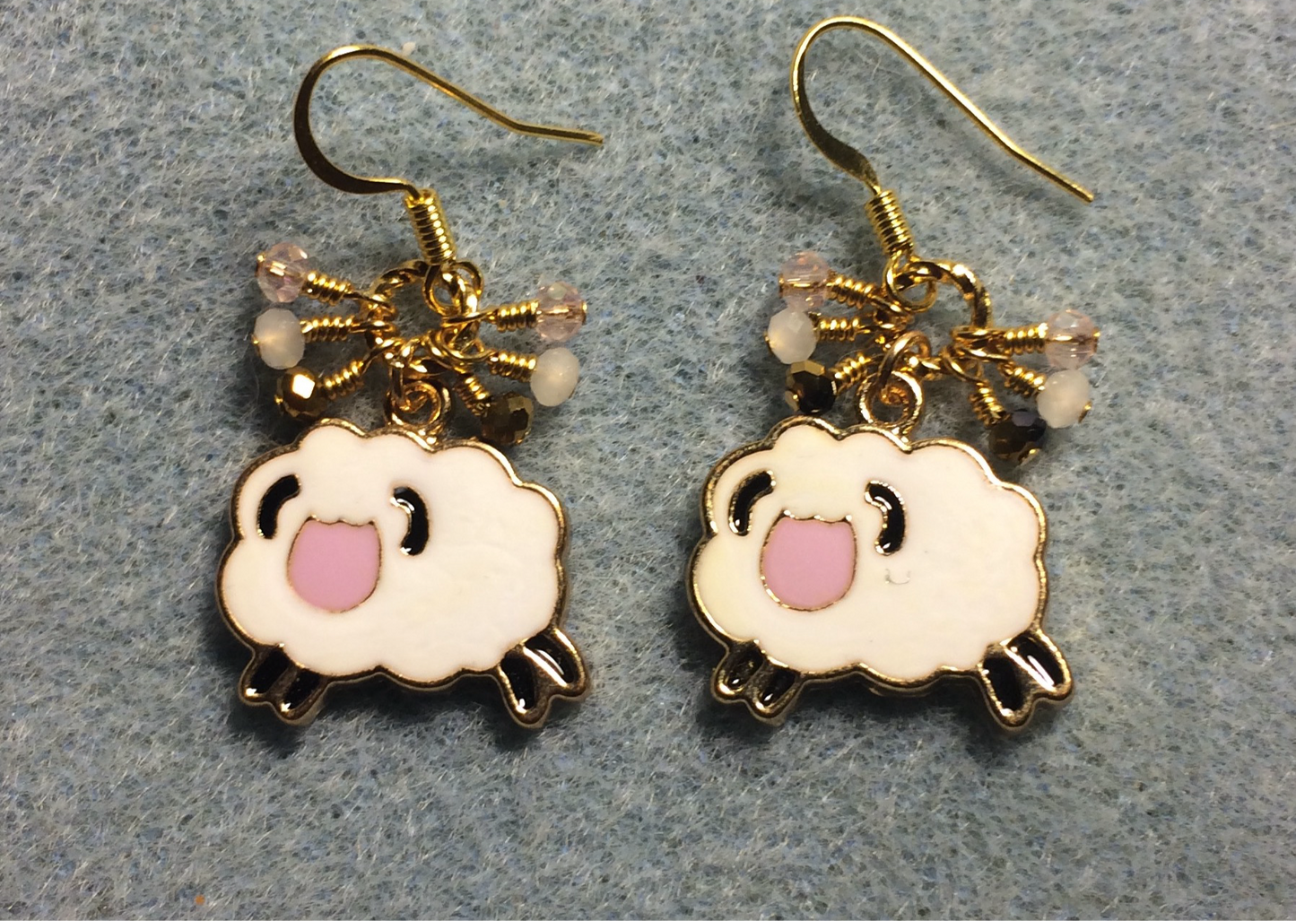 Pink, white, and gold enamel sheep charm earrings adorned with tiny dangling pink, white, and gold Chinese crystal beads.