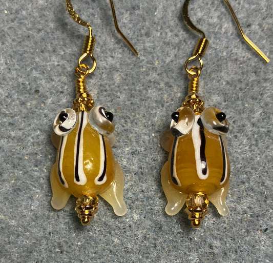 Very small golden yellow with black stripes lamp work frog bead earrings adorned with golden yellow Chinese crystal beads.