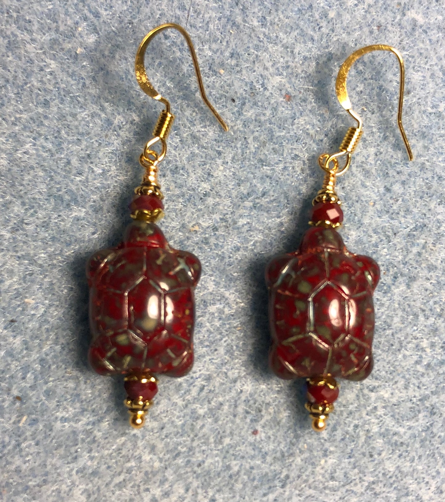 Dark red Picasso Czech glass turtle bead earrings adorned with dark red Chinese crystal beads.