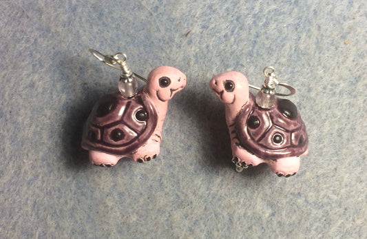 Large light pink and violet ceramic turtle bead earrings adorned with violet Czech glass beads.