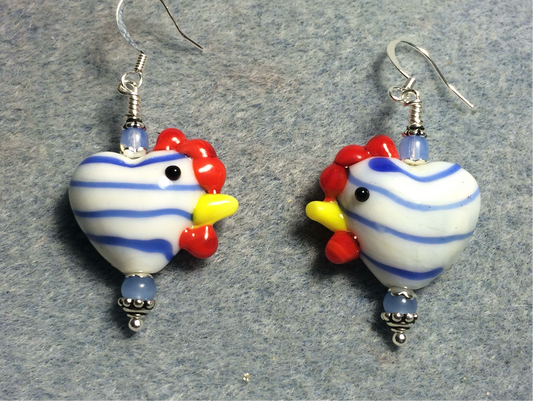 White with light blue stripes heart shaped lamp work hen bead earrings adorned with light blue Czech glass beads.
