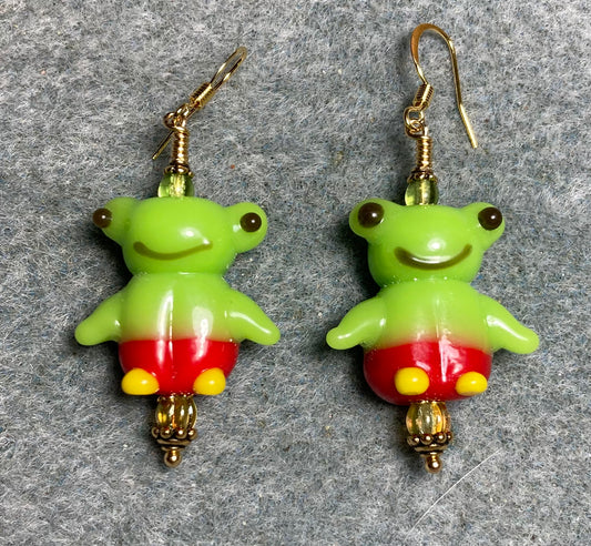 Lime green, red, and yellow silly lamp work frog bead earrings adorned with lime green Czech glass beads.