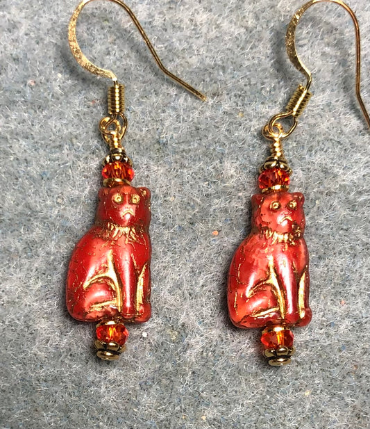 Small opaque orange (with gold inlay) Czech glass cat bead earrings adorned with orange Chinese crystal beads.