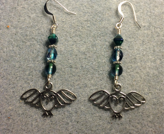 Silver flying owl charm earrings adorned with blue green Czech glass beads