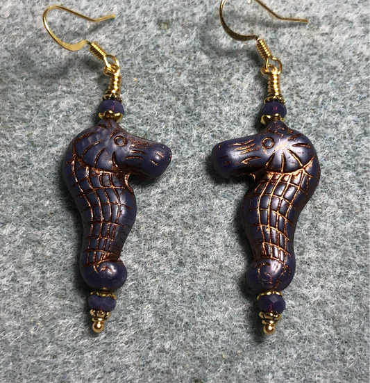 Dark purple (with copper inlay) Czech glass seahorse bead earrings adorned with purple Chinese crystal beads.