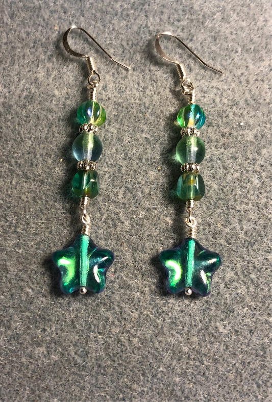 Small metallic blue green Czech glass star bead earrings adorned with blue green Czech glass beads.