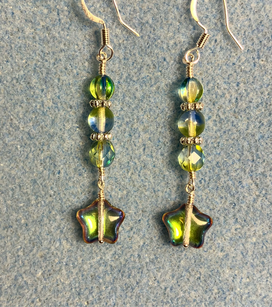 Small metallic light green Czech glass star bead earrings adorned with light green Czech glass beads.