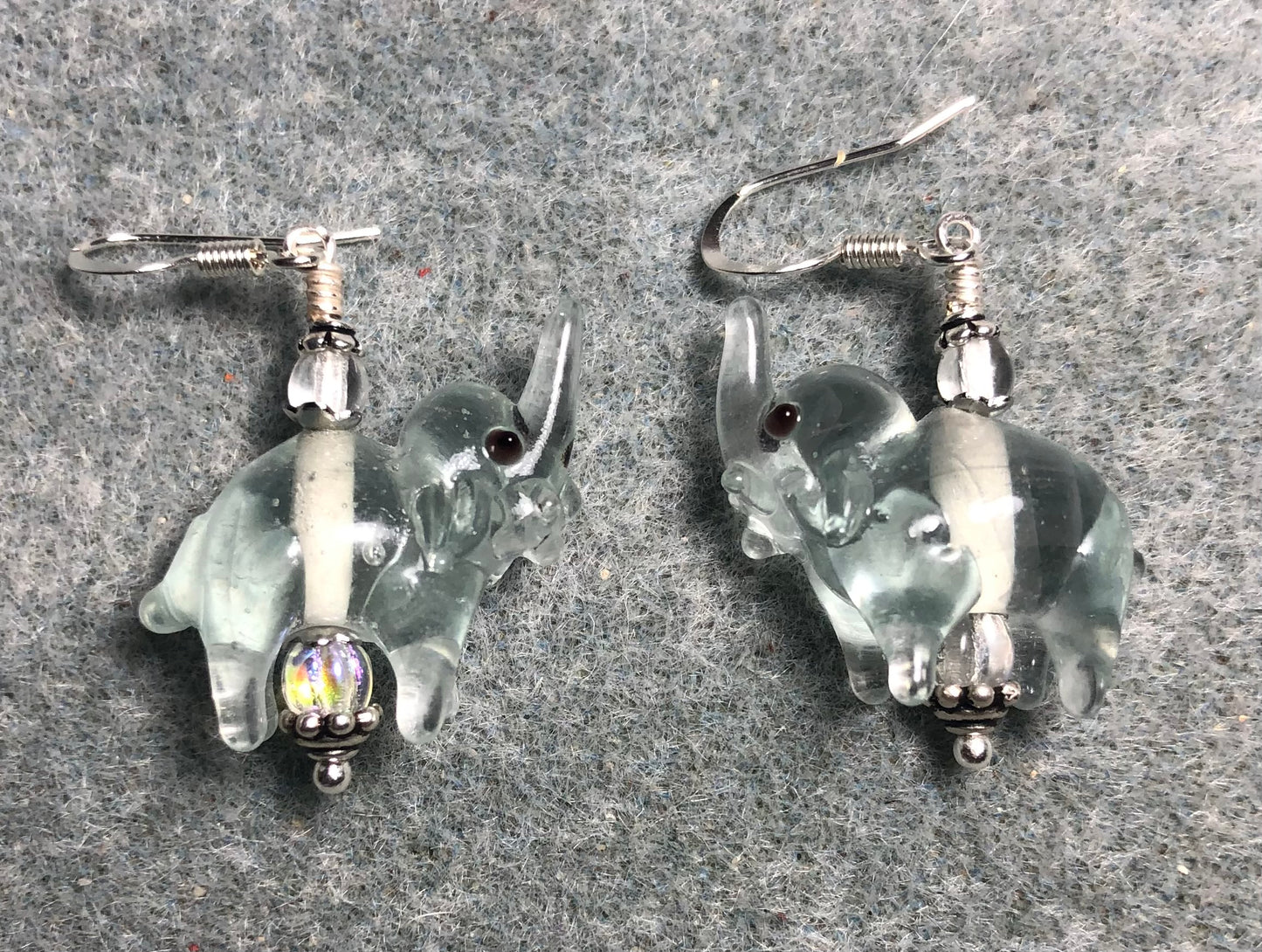Clear lamp work elephant bead earrings adorned with clear Czech glass beads.