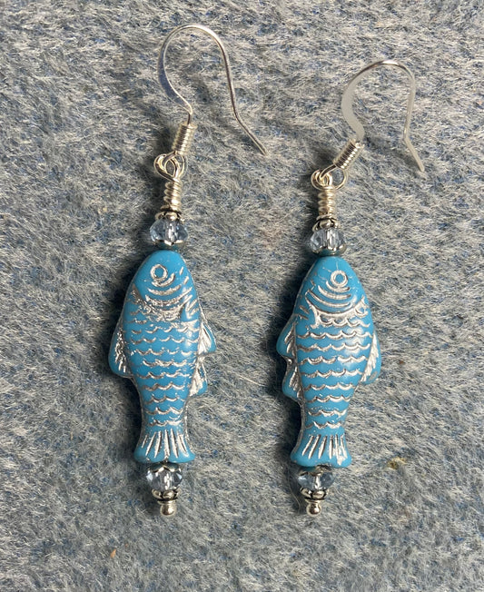 Light blue (with silver inlay) Czech glass fish bead earrings adorned with light blue Chinese crystal beads.