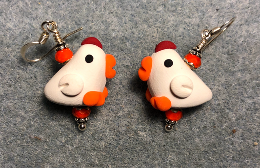 White, orange, and red polymer clay chicken bead earrings adorned with orange Czech glass beads.