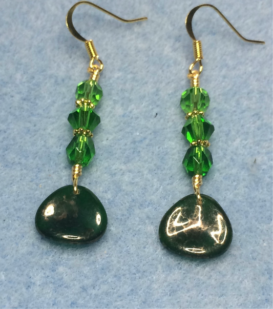 Emerald green Czech glass rose petal earrings adorned with emerald green Czech glass beads.