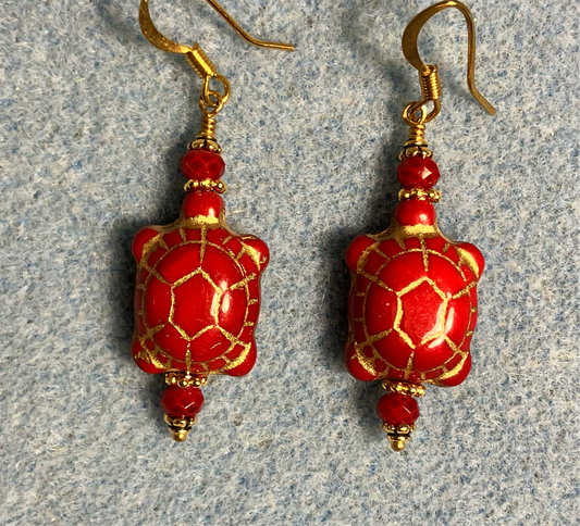 Opaque red (with gold inlay) Czech glass turtle bead earrings adorned with red Chinese crystal beads.